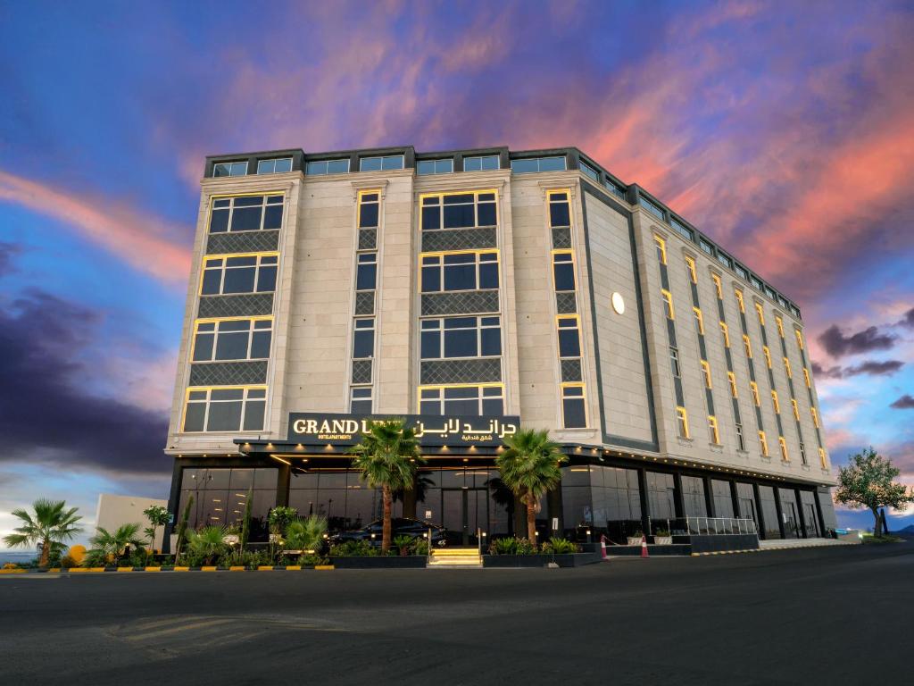 a rendering of a grand hotel with a sunset at Grand Line جراند لاين in Tabuk