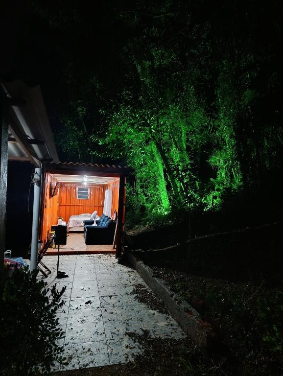 a room with a bed in a tent at night at Made in Roça in Piedade