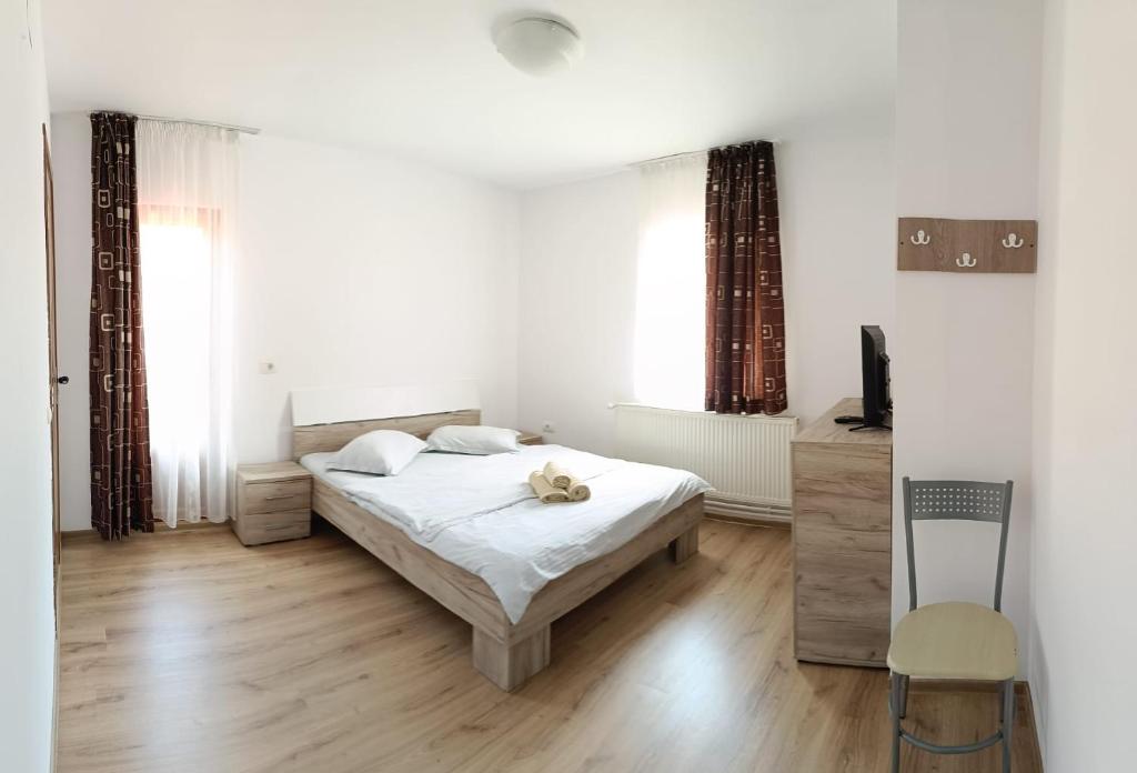 Postel nebo postele na pokoji v ubytování Vila Carmen