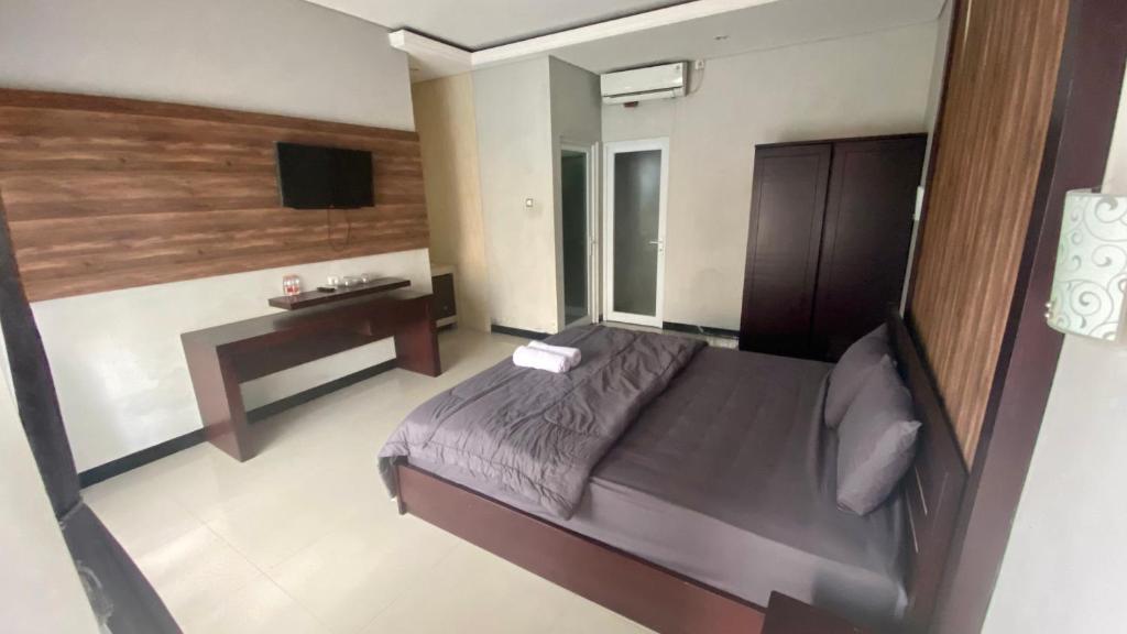 Ένα ή περισσότερα κρεβάτια σε δωμάτιο στο Semilang House