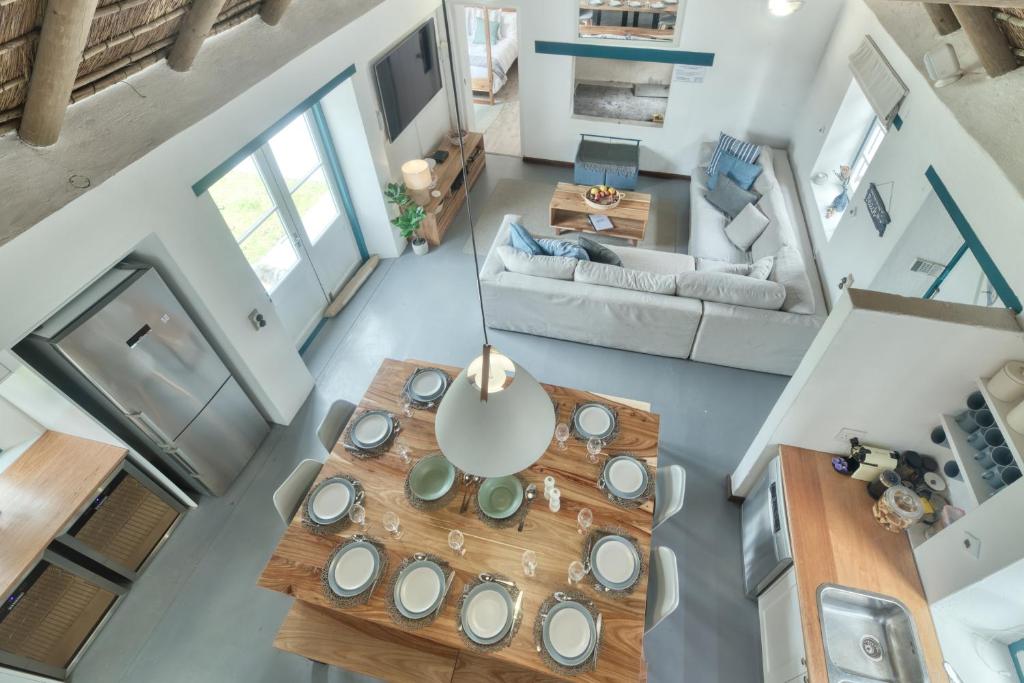 an overhead view of a living room with a table at Cape Creek Cottage in Struisbaai