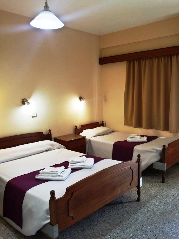 Postel nebo postele na pokoji v ubytování Minaides Hotel