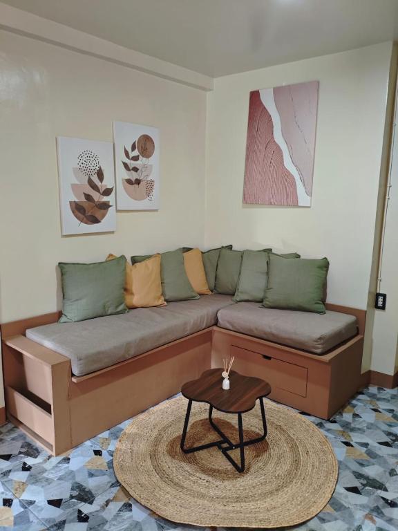 a living room with a couch and a table at El Nido Lofts - The Apartment in El Nido