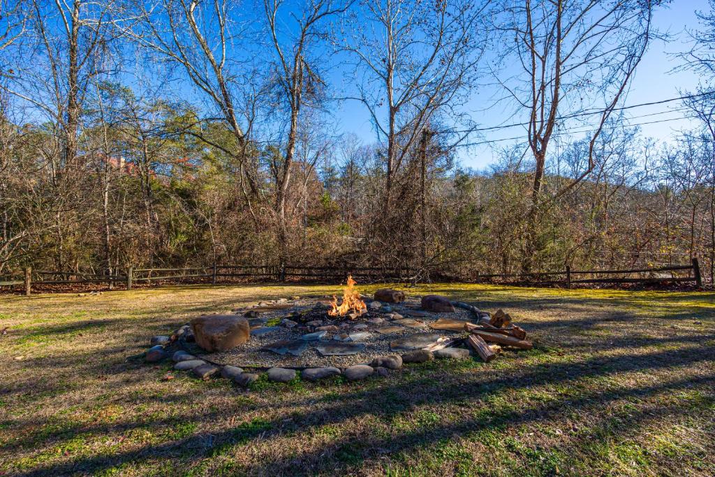 a fire pit in the middle of a field at Rustic Ranch by American Patriot Getaways in Waldens Creek