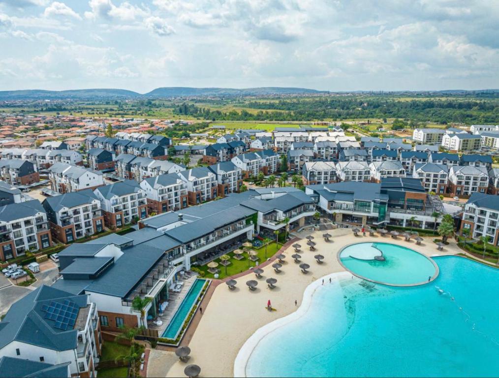 an aerial view of a resort with a swimming pool at The Blyde Crystal Lagoon - 3 Bedrooms with Lagoon Views in Pretoria