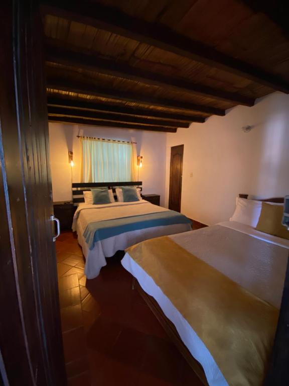 Postel nebo postele na pokoji v ubytování Hospederia Montano Alto