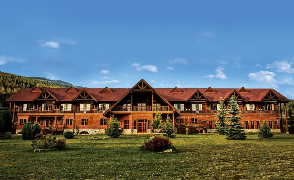 a small town with a large building at Glacier House Hotel & Resort in Revelstoke