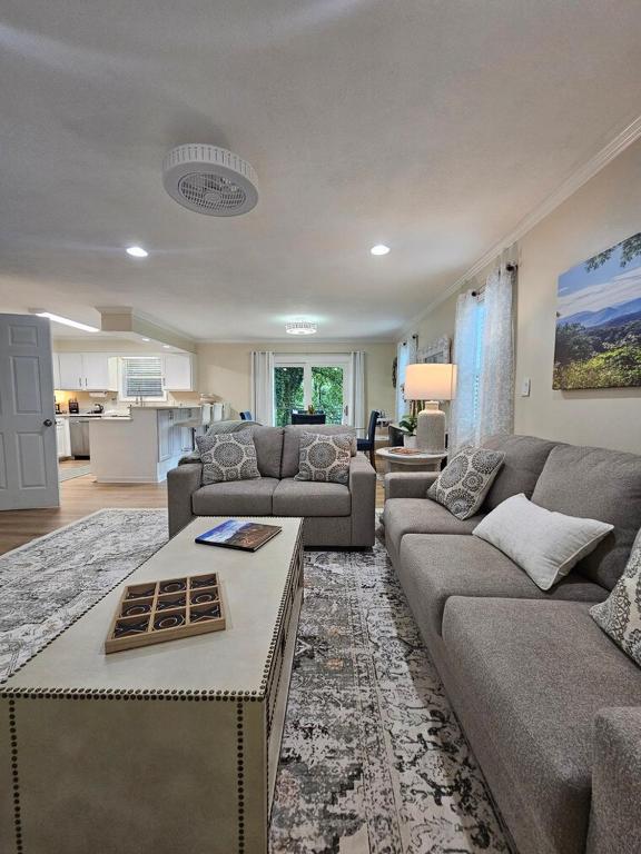 a living room with a couch and a table at Hillside Retreat in Knoxville