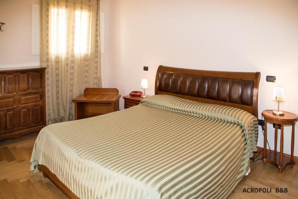 Postel nebo postele na pokoji v ubytování Residence Acropoli