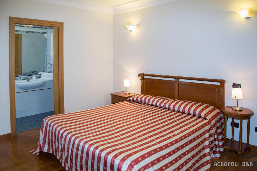 Postel nebo postele na pokoji v ubytování Residence Acropoli