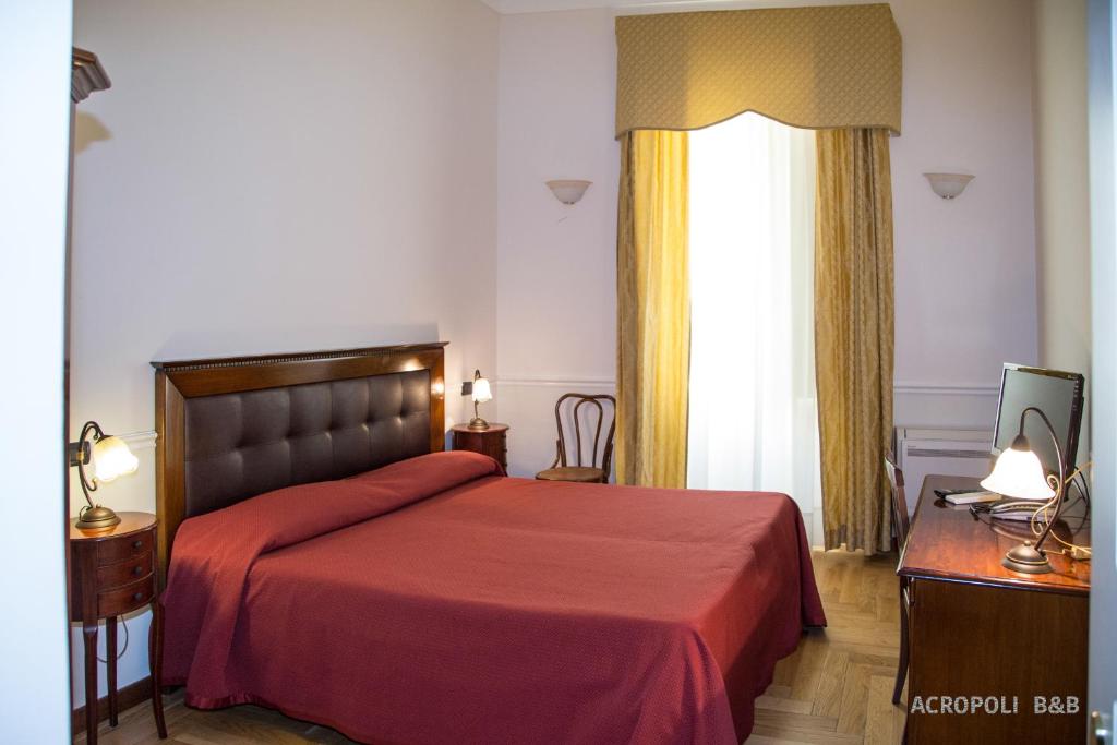 Postel nebo postele na pokoji v ubytování Residence Acropoli