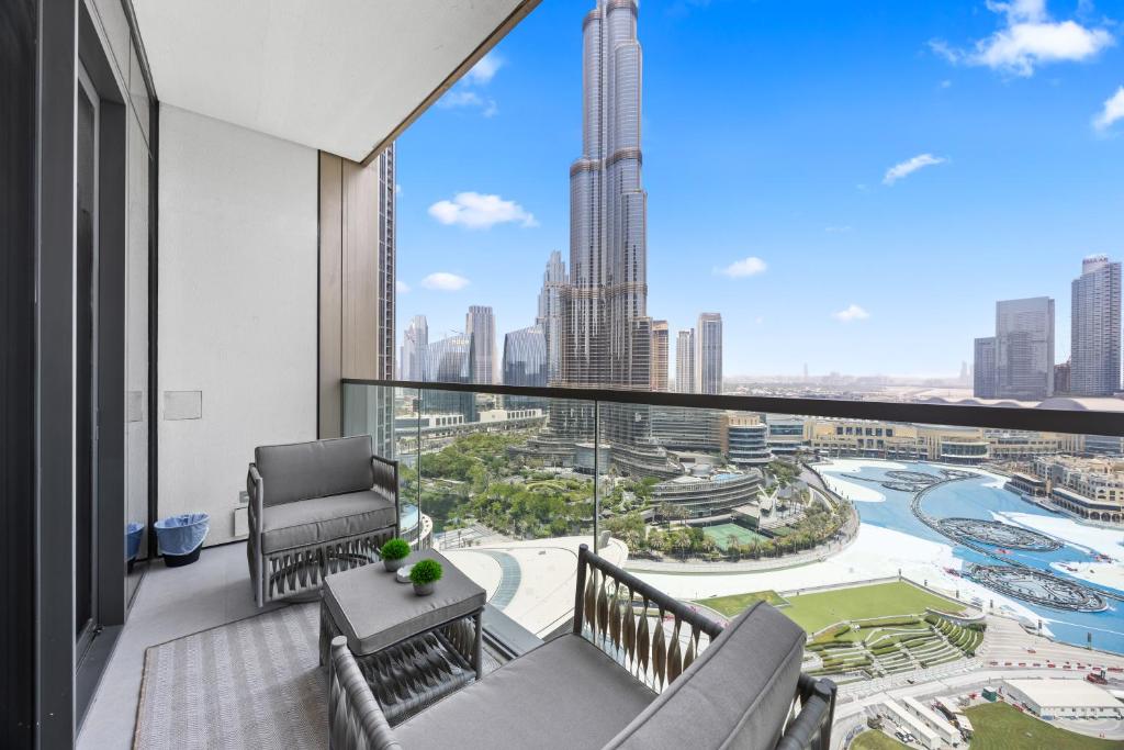 a balcony with a view of the city at Burj Khalifa and Dubai Fountian Direct View - Luxury 2BR Flat - Downtown Dubai in Dubai