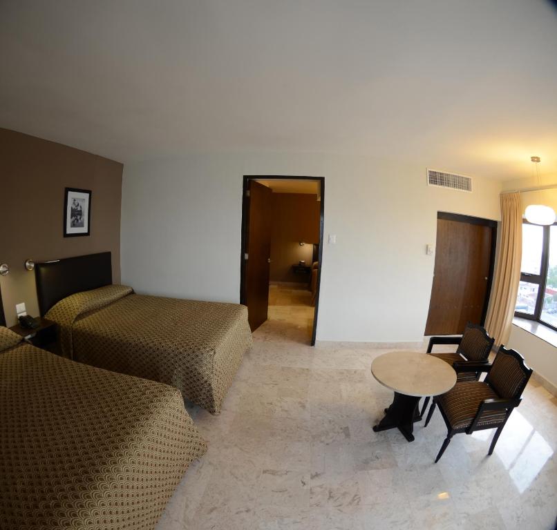 Postel nebo postele na pokoji v ubytování Hotel Mar y Tierra