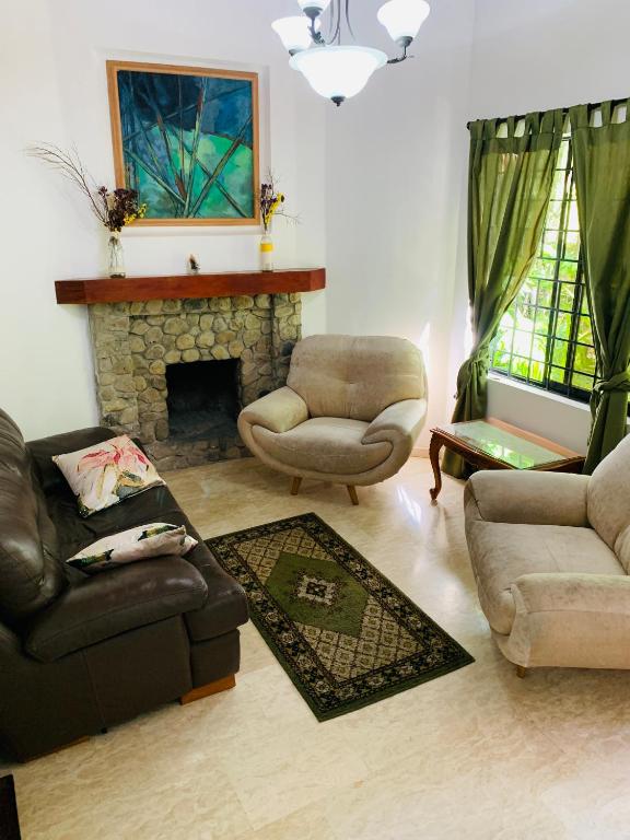 a living room with two couches and a fireplace at Casa Campestre Poblado para 10H San Lucas 106 in Medellín