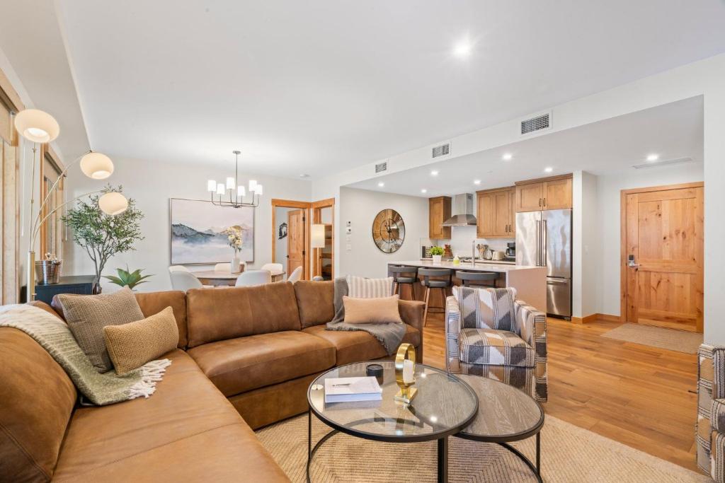 a living room with a couch and a table at Timberstone Condo by Canadian Rockies Vacation Rentals in Canmore