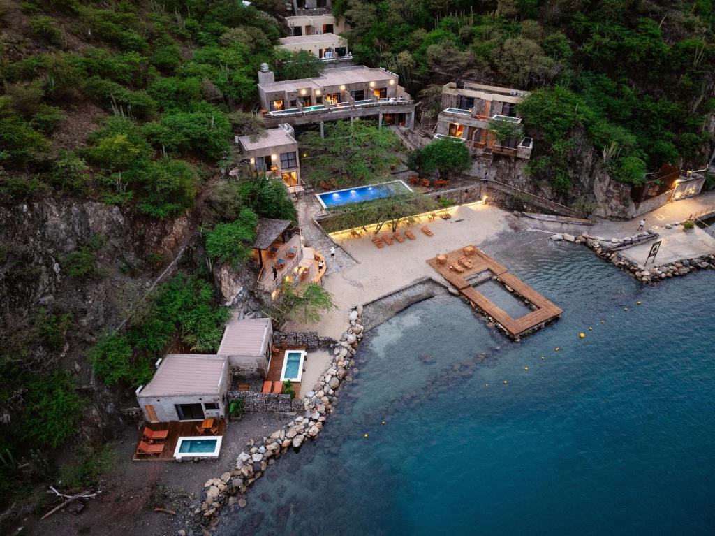 an aerial view of a house in the water at Perla Roca Hotel Boutique - Beach Front in Santa Marta