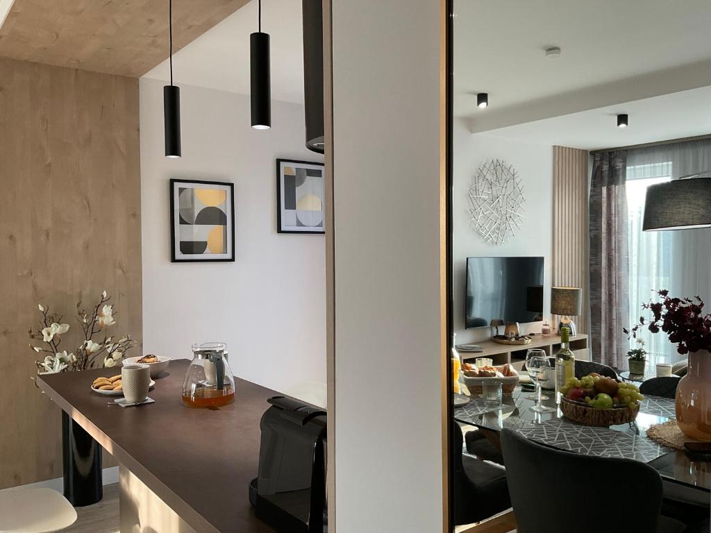 a kitchen and dining room with a table and chairs at Weekend House Alsóörs in Alsóörs