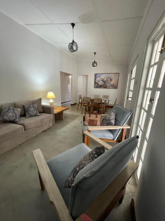 a living room with a couch and a table at Angel's Home in Hatton