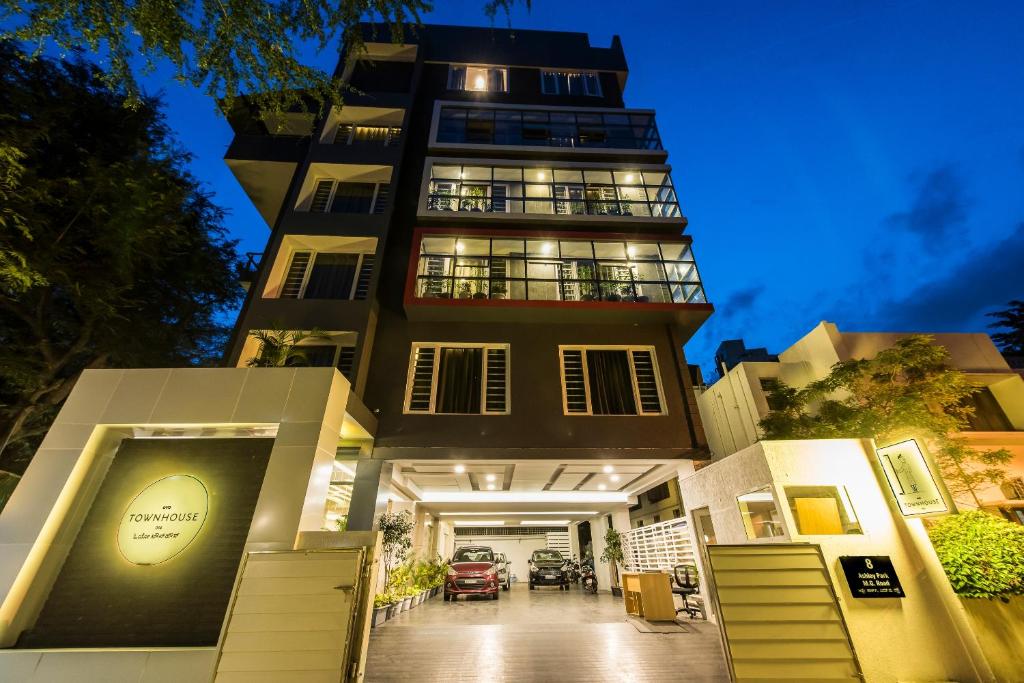a tall building with a sign on the front of it at Super Townhouse MG Road,Bangalore in Bengaluru