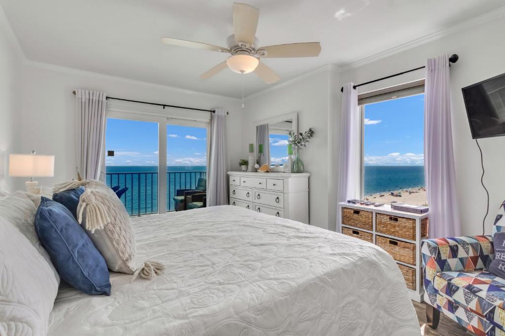 a bedroom with a bed and a view of the ocean at Ocean House 1806 in Gulf Shores