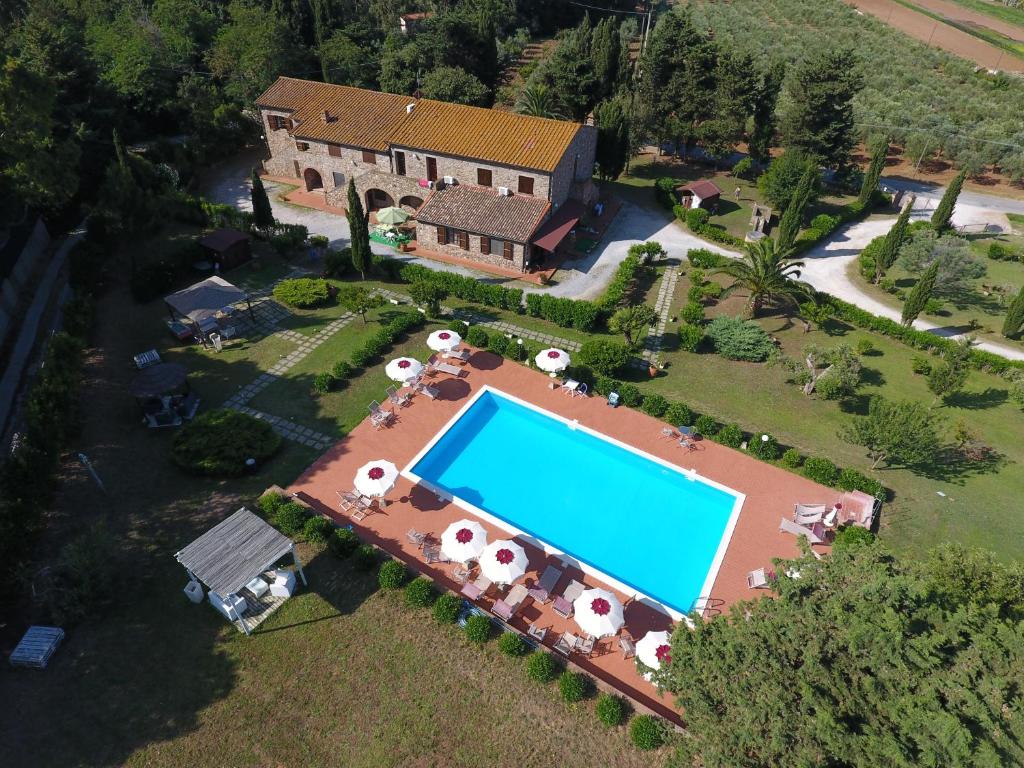 an aerial view of a house with a swimming pool at Residence La Casaccia in Venturina Terme