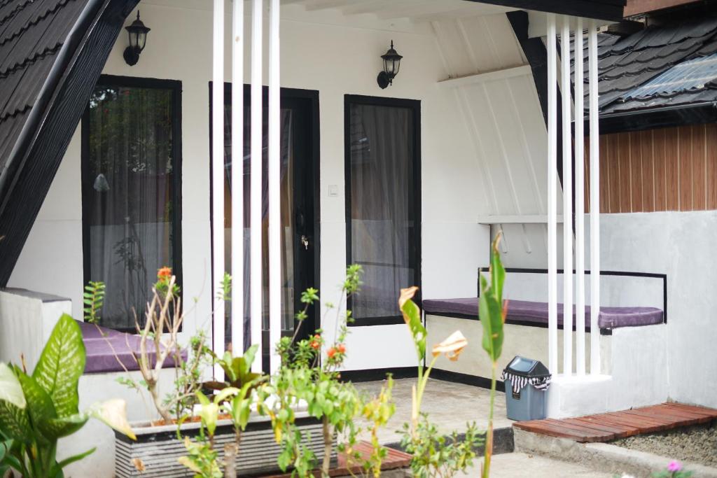 a house with plants on the front porch at TottyHouse Gili Trawangan in Gili Trawangan