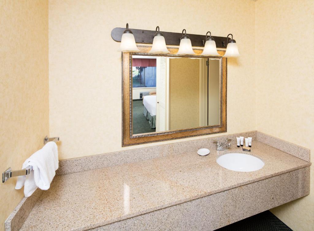 a bathroom with a sink and a mirror at Red Lion Hotel Pendleton in Pendleton