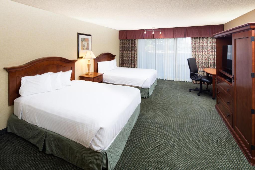 a hotel room with two beds and a television at Red Lion Hotel Pendleton in Pendleton