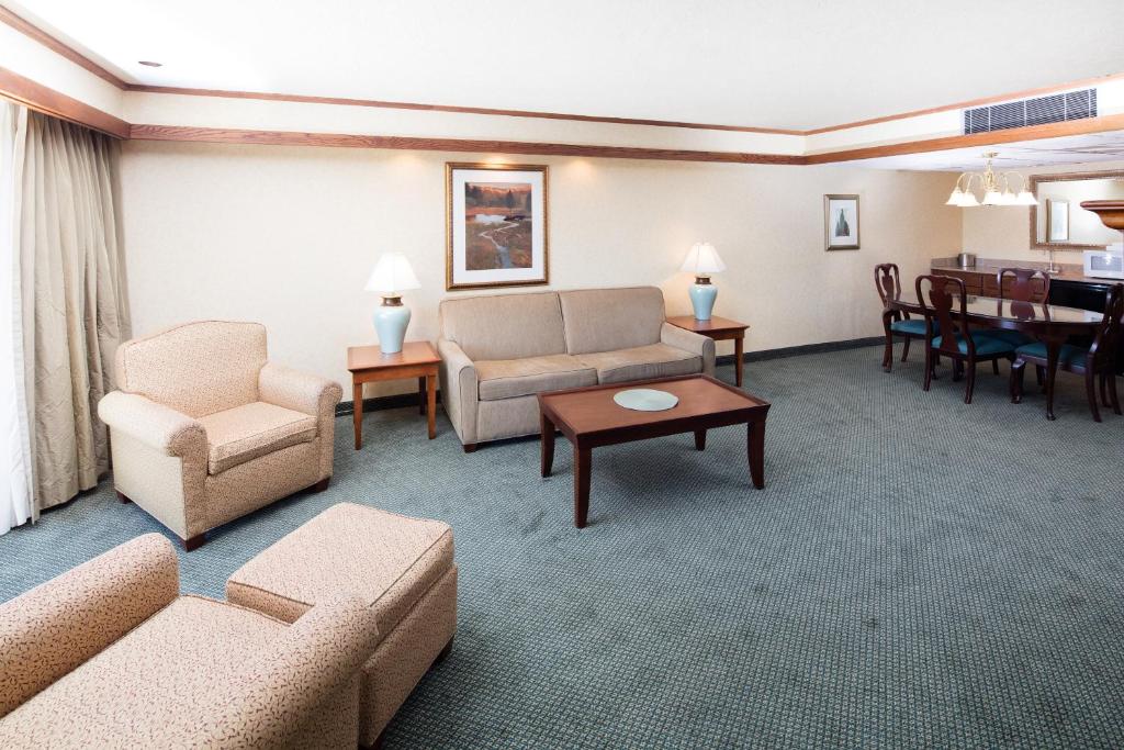 a living room with a couch and chairs and a table at Red Lion Hotel Pendleton in Pendleton