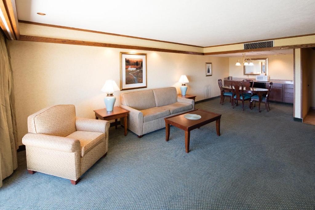 a living room with a couch and chairs and a table at Red Lion Hotel Pendleton in Pendleton