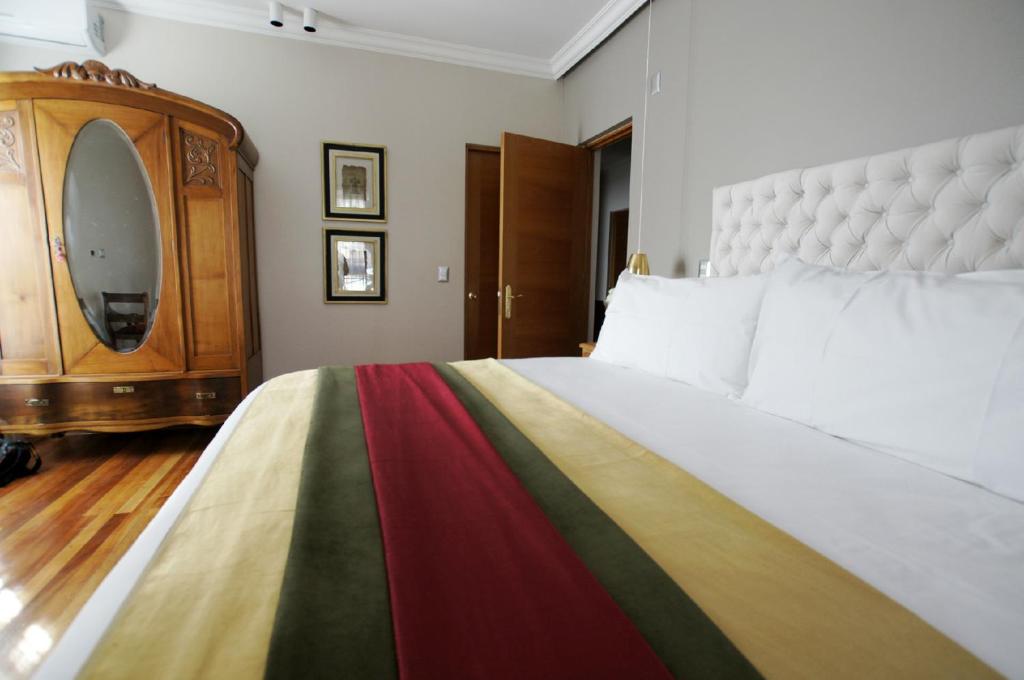 Postel nebo postele na pokoji v ubytování Quiral Hotel Boutique