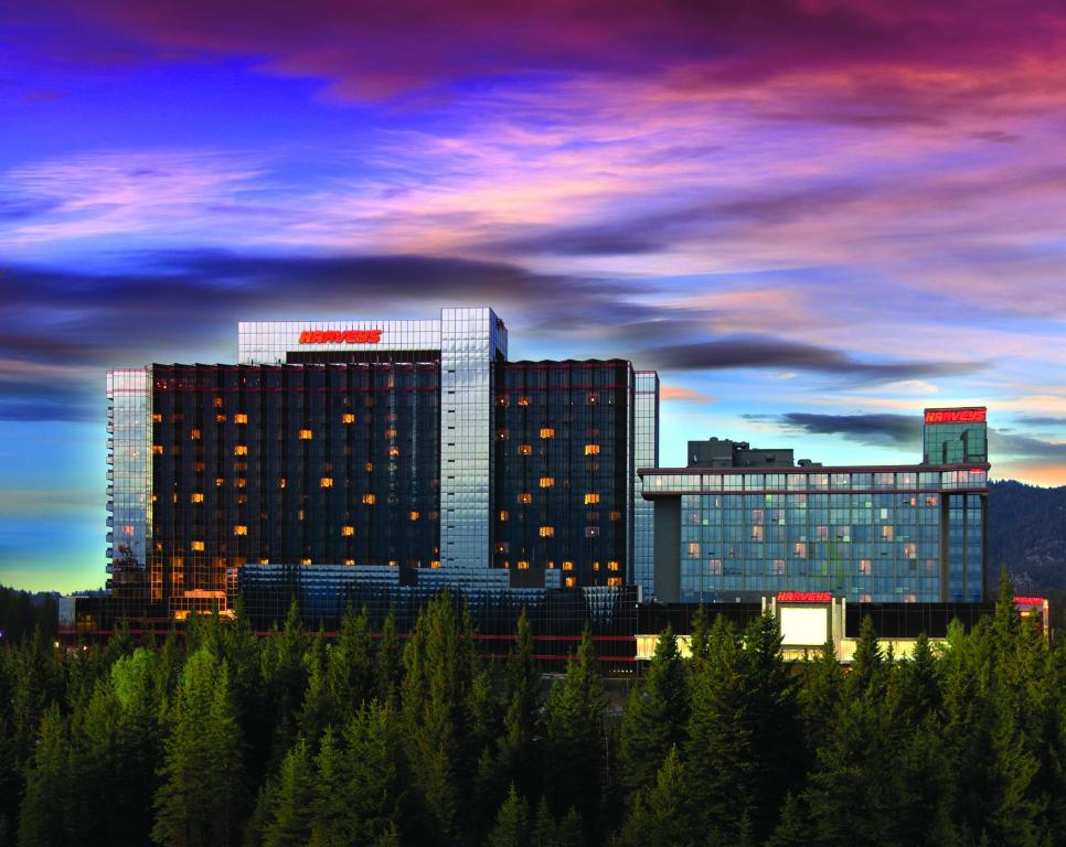 a large building with trees in front of it at Harveys Lake Tahoe Hotel & Casino in Stateline