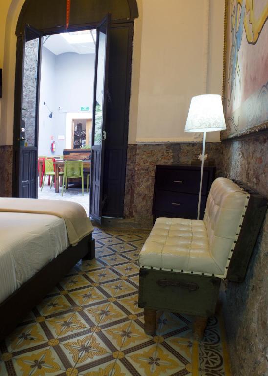 Postel nebo postele na pokoji v ubytování Kuku Ruku Hotel