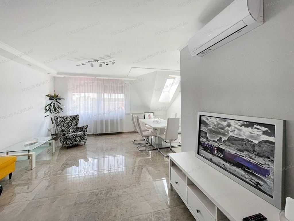 a living room with a large flat screen tv on a wall at Bem in Kecskemét