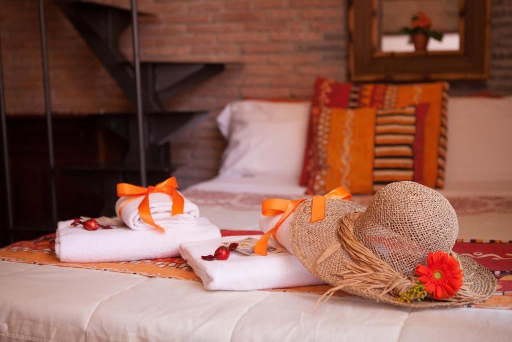 A bed or beds in a room at Cà de Matagè