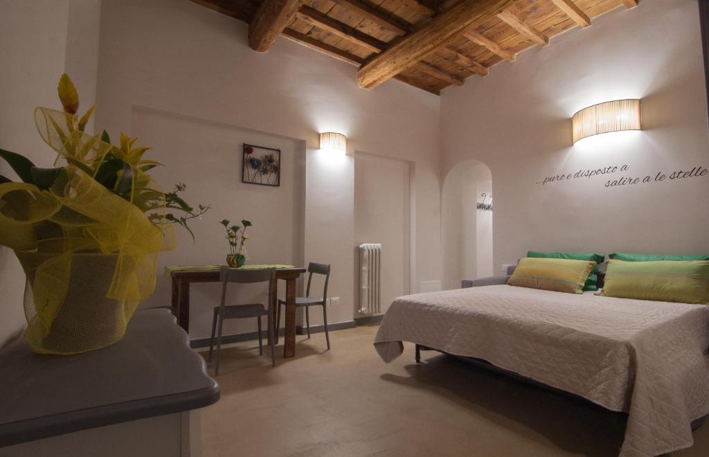 Postel nebo postele na pokoji v ubytování La Divina Dimora