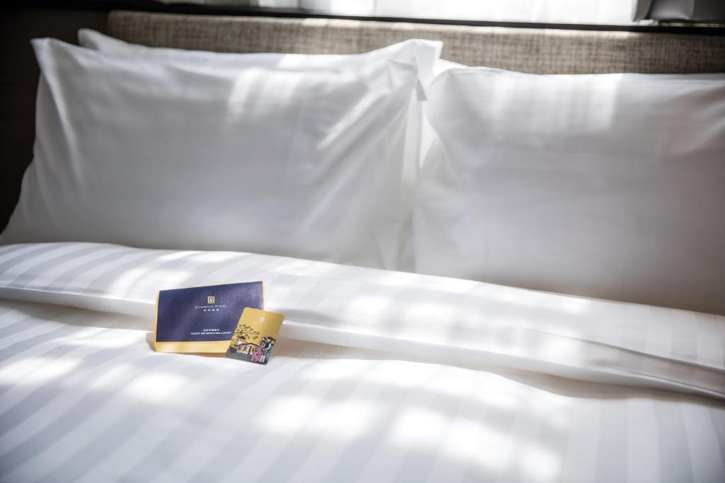 Postel nebo postele na pokoji v ubytování Changyu Hotel