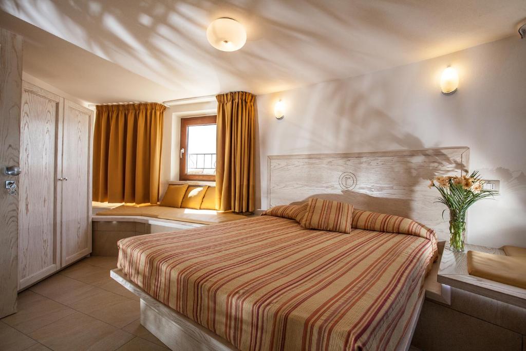 Łóżko lub łóżka w pokoju w obiekcie Hotel Raffael PHG