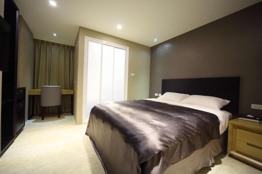 Postel nebo postele na pokoji v ubytování E-House Xining Branch