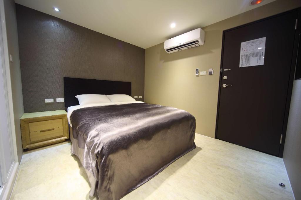 Postel nebo postele na pokoji v ubytování E-House Xining Branch