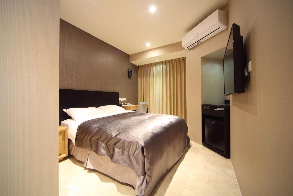 Postel nebo postele na pokoji v ubytování E-House Xining Branch