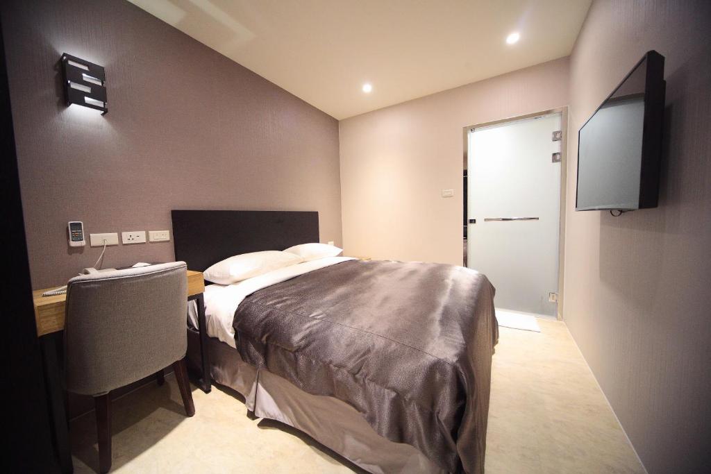 Postel nebo postele na pokoji v ubytování E-House Xining Branch