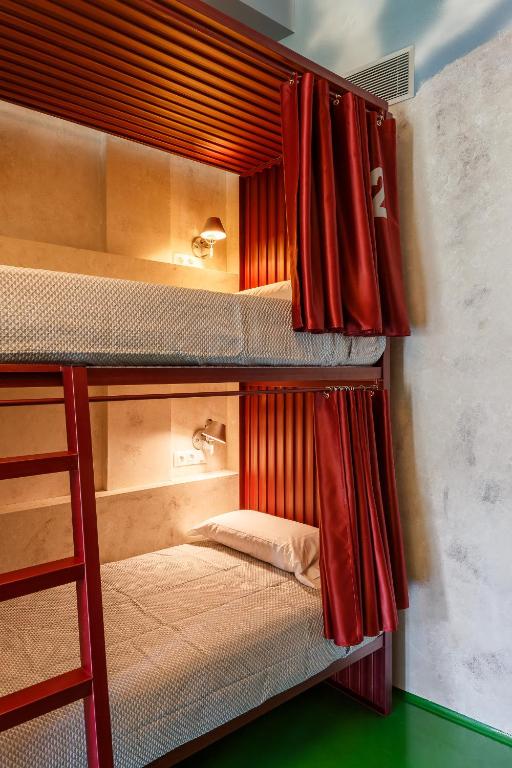 A bed or beds in a room at Blanco Albergue