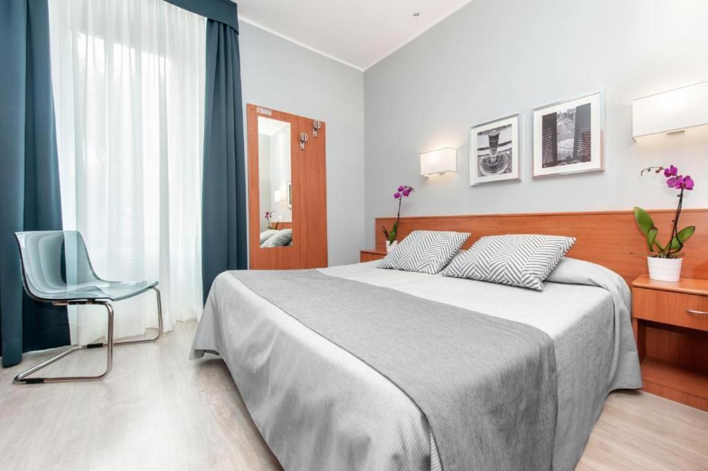 Ένα ή περισσότερα κρεβάτια σε δωμάτιο στο Reyes Suite & Rooms