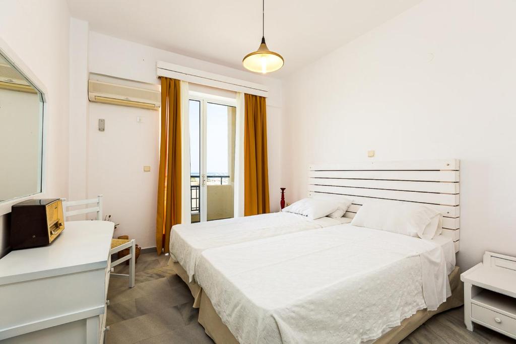 Postel nebo postele na pokoji v ubytování Castello Bianco Aparthotel