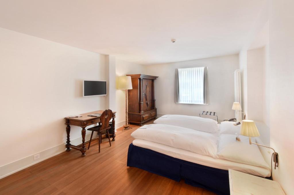 Postel nebo postele na pokoji v ubytování Hotel im Schlosspark