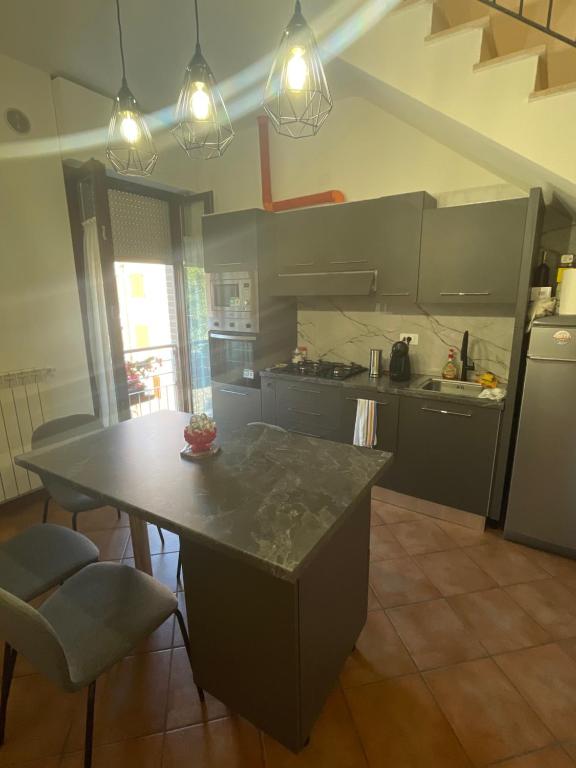 a kitchen with a table and a counter top at Dal Barbaresco Siena in Siena
