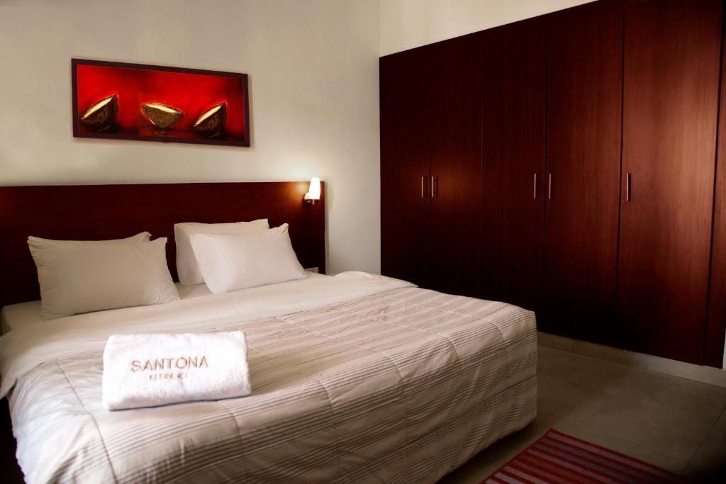 Postel nebo postele na pokoji v ubytování Santona Residence