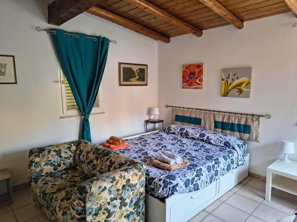 Ένα ή περισσότερα κρεβάτια σε δωμάτιο στο La casa della nonna