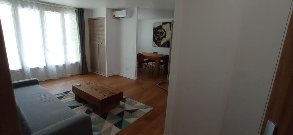 a living room with a couch and a coffee table at TRINQUAT Gare Saint Roch in Montpellier